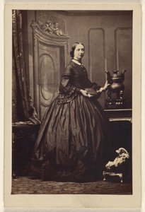 [Donna non identificata con un libro in mano, in piedi]. da Camille Silvy