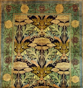 Un tappeto di lana di Donegal con un disegno floreale da Charles Francis Annesley Voysey