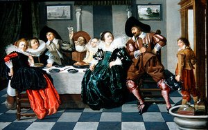 Compagnia elegante a un tavolo in un interno