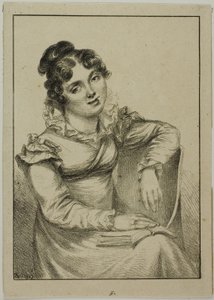 Giovane donna seduta con un libro aperto