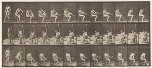 Piatto 418. Toilette, seduta e indossando calze