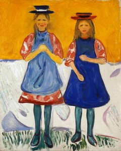 Due bambine con grembiuli blu