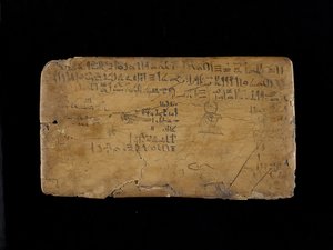 Tavola di scrittura con versi dall