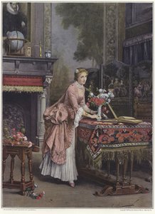 Una donna che mette un vaso di fiori su un tavolo