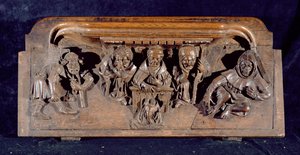 Una misericordia che raffigura un accademico seduto a una scrivania che ammonisce un penitente inginocchiato, Cappella del New College, Oxford, fine XIV secolo