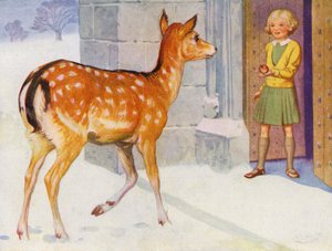 Ragazza che nutre un cervo nella neve