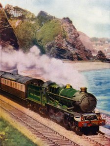 Re Carlo II, locomotiva a vapore classe King 4-6-0 della Great Western Railway (GWR), che traina il Cornish Riviera Express lungo la costa tra Dawlish e Teignmouth, Devon da English School