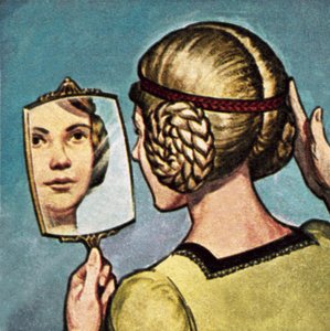 Ragazza medievale che guarda in uno specchio da English School