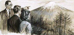 Uomo non identificato che indica il monte Fuji in Giappone