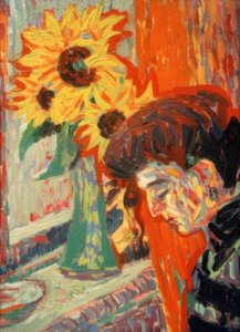Testa di donna davanti ai girasoli