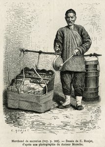 Il mercante di zucchero che colpisce un tamburo piatto per attirare l