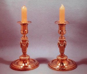 Due candelabri (argento dorato)