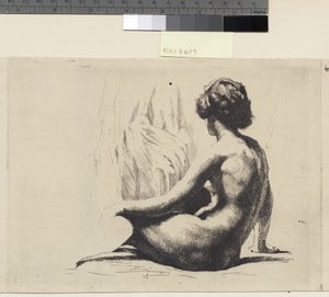 Modella femminile nuda seduta sul pavimento
