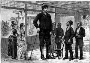 Amanab (o Auvassab, con il suo vero nome Amenates Tingitsoglu 1868-1887), un gigante greco alto 2,36 metri, che gira per le capitali europee, che ha ispirato un gigante nella storia "Il testamento di un eccentrico" di Jules Verne (1828-1905). Incisione in 