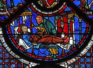 La finestra del Buon Samaritano: il Samaritano cura l