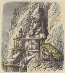 Scultura di una statua di un faraone egiziano antico da una parete rocciosa da German School