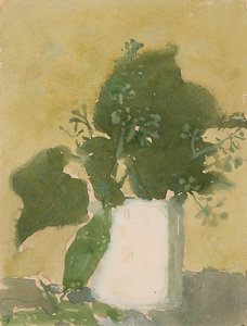 Foglie verdi in una brocca bianca
