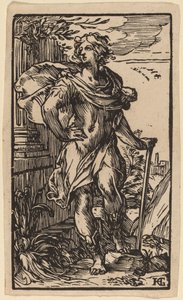 Giovane in piedi con un bastone