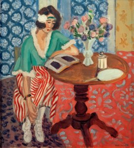 Donna che legge a un tavolo ((in abito a righe verdi e rosse)) da Henri Matisse