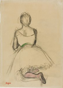 Ballerina inginocchiata, vista da dietro