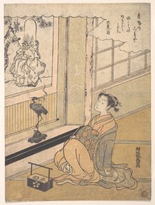 Una giovane donna seduta in una stanza guarda un kakemono di Fukurokujin da Isoda Koryusai
