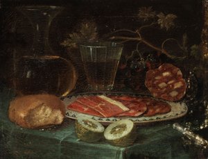 Natura morta con pezzo di pane, caraffa di vetro, bicchiere di vino, piatto con prosciutto e salsiccia di prosciutto, limone e coltello con manico di madreperla da Italo flämischer Maler des 17. Jahrhunderts