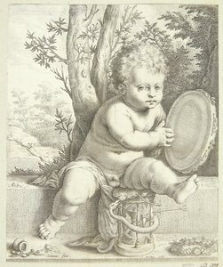Un bambino che suona il tamburello