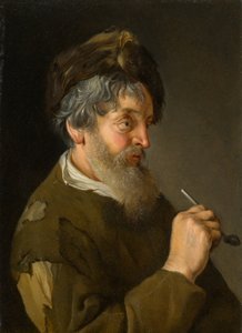 Un uomo barbuto che tiene una pipa