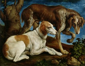 Due cani da caccia legati a un ceppo d