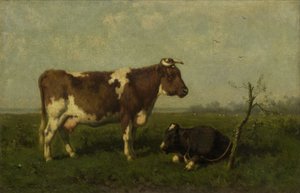 Mucca con il suo vitello in un prato