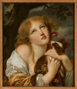 Ragazza con un cane in braccio