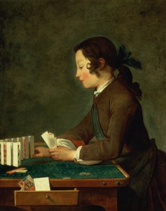 Giovane ragazzo che gioca a carte