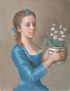 Giovane ragazza con un vaso di giacinti