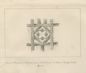 Pannello ornamentale in pietra su una casa antica: disegno a seppia