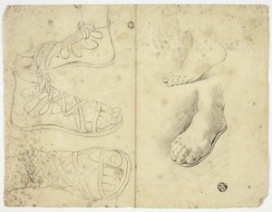 Due piedi nudi e tre piedi di sabbia