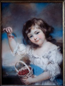 Ritratto di una bambina nel cesto di ciliegie