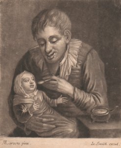 Uomo che nutre un bambino