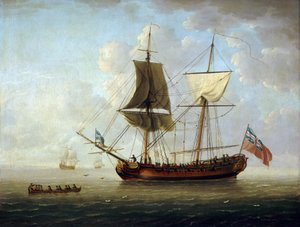 Una brigantina britannica, con bandiera rossa e Union Jack, al largo in mare calmo