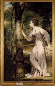 Una donna di grande eleganza incide un nome su un tronco d