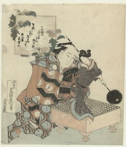 Un burattinaio con burattino e tavola da gioco go da Katsushika Hokusai