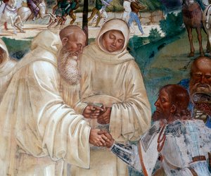 Benedetto accoglie Totila che è venuto a scusarsi per aver messo alla prova Benedetto - Dettaglio affresco del chiostro realizzato da Luca Signorelli che racconta la vita di San Benedetto da Norcia da Luca Signorelli