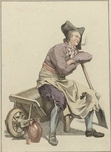 Uomo seduto sul bordo di una carriola