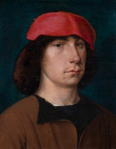 Un giovane con un berretto rosso