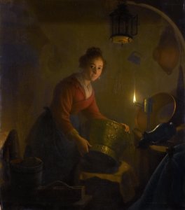 Donna in cucina alla luce di una candela da Michiel Versteegh