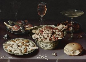 Natura morta con dolci, castagne e un panino