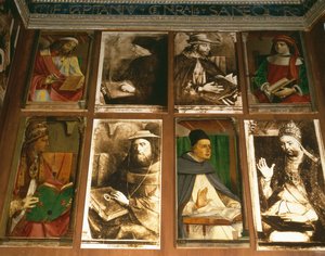 Lo studio di Federico da Montefeltro, Duca di Urbino, in senso orario da TL: Euclide di Megara, filosofo greco; Vittorino da Feltre, educatore italiano; Solone, legislatore ateniese da P. Joos van Gent and Berruguete