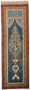 Un kalimkari di cotone smaltato dipinto e stampato con pappagalli e altri uccelli posati sui rami di un albero fiorito a forma di fiamma da Persian School