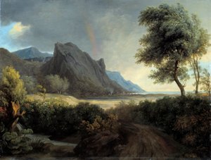 Paesaggio montuoso bagnato dal mare. Arcobaleno.