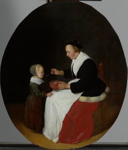 Una Madre che Dà la Pappa al suo Bambino