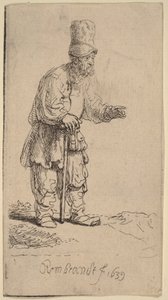 Un contadino con un berretto alto, in piedi e appoggiato a un bastone da Rembrandt van Rijn